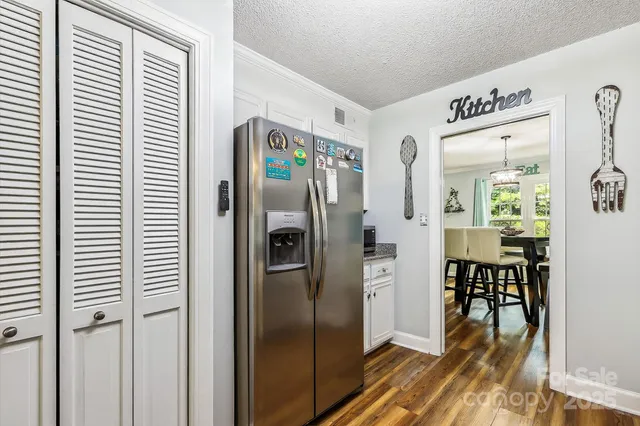 a view of a kitchen from the hallway