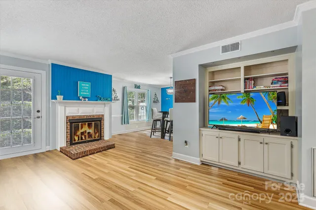 a view of a livingroom with furniture and a fireplace