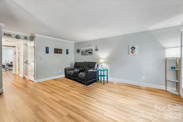 a bedroom with a bed window and a dresser