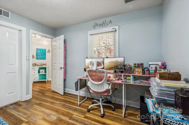 a workspace with furniture and a window