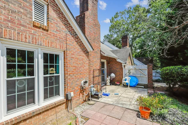 a view of a house with sitting area and garden