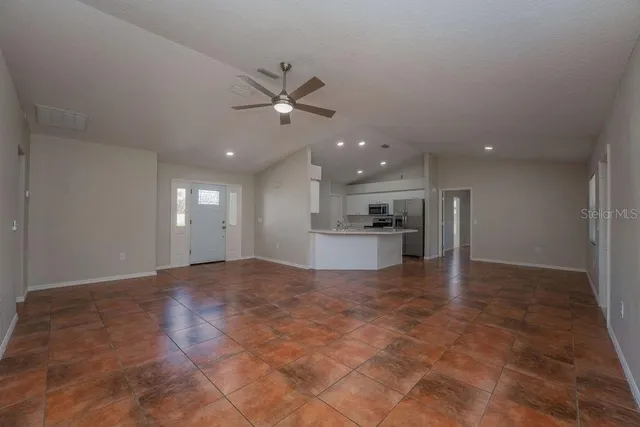 a view of a kitchen with a sink and a stove
