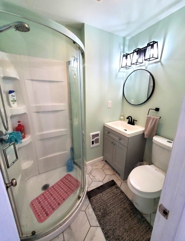 5 Elm Street Plympton, MA 02367 - Photo 11 of 19 a bathroom with a toilet a sink and a mirror