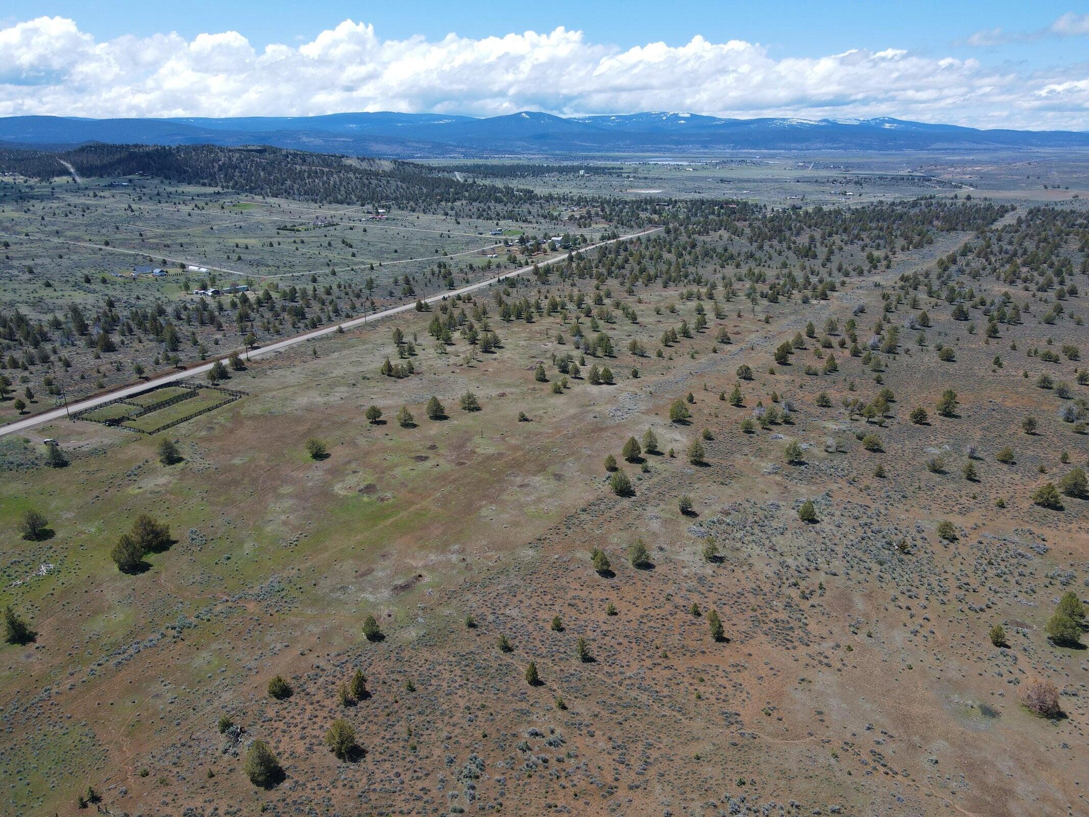 3234 County Road 75 Alturas, CA 96101 - Photo 44 of 44 a view of a dry yard with mountains in the background