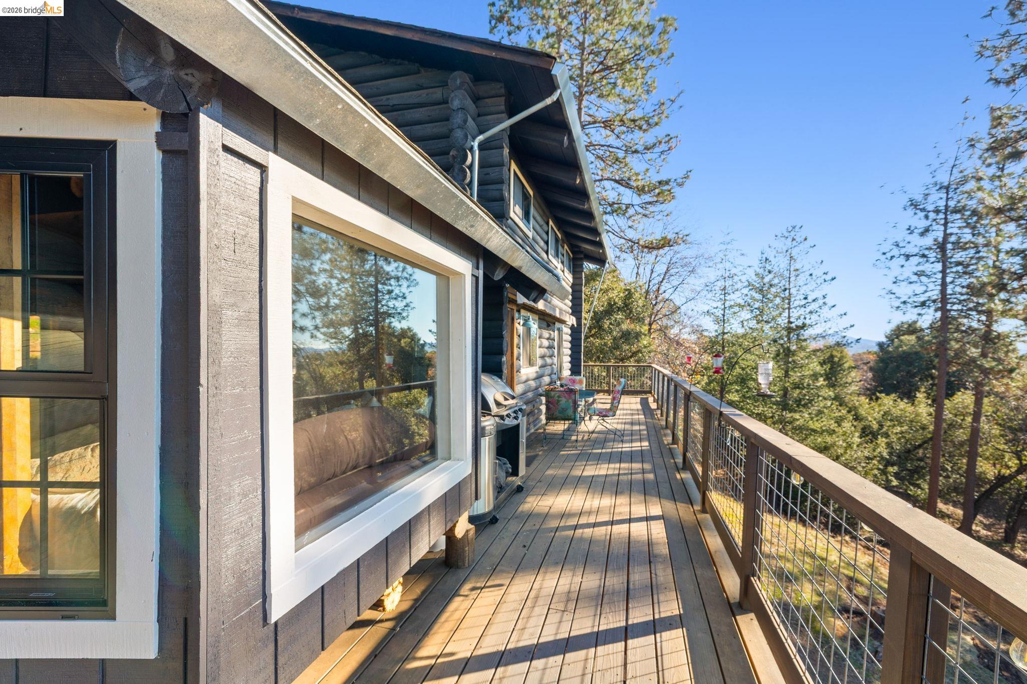 16144 Big Hill Road Sonora, CA 95370 - Photo 34 of 51 Expansive wooden deck with wire grid railing