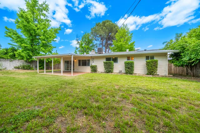 front view of a house with a garden