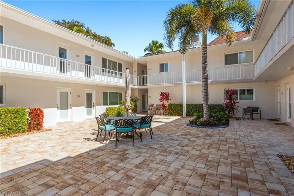 582 Broad Avenue South, Unit 582 Naples, FL 34102 - Photo 23 of 36 a view of a house with backyard and sitting area