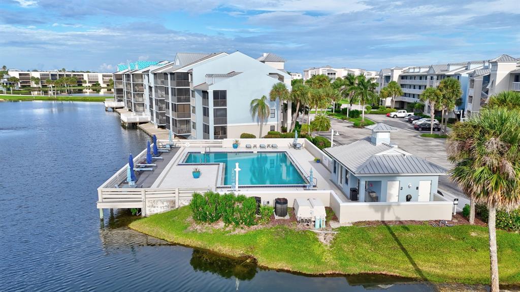 40 Northeast Plantation Road, Unit 109 Stuart, FL 34996 - Photo 6 of 41 a front view of building with outdoor seating