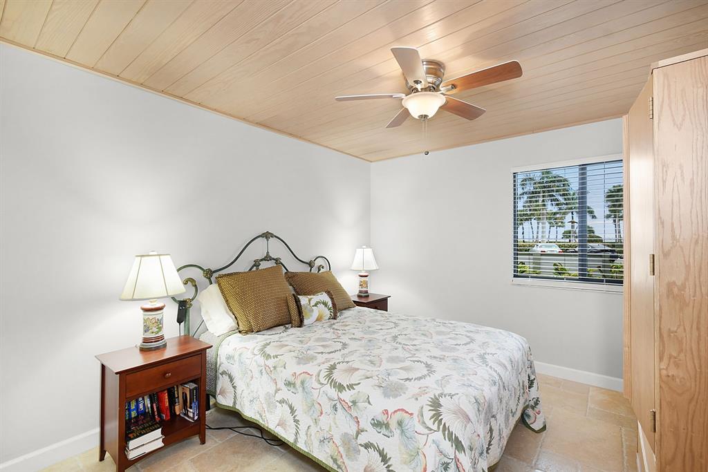 40 Northeast Plantation Road, Unit 109 Stuart, FL 34996 - Photo 8 of 41 a bedroom with a bed and window