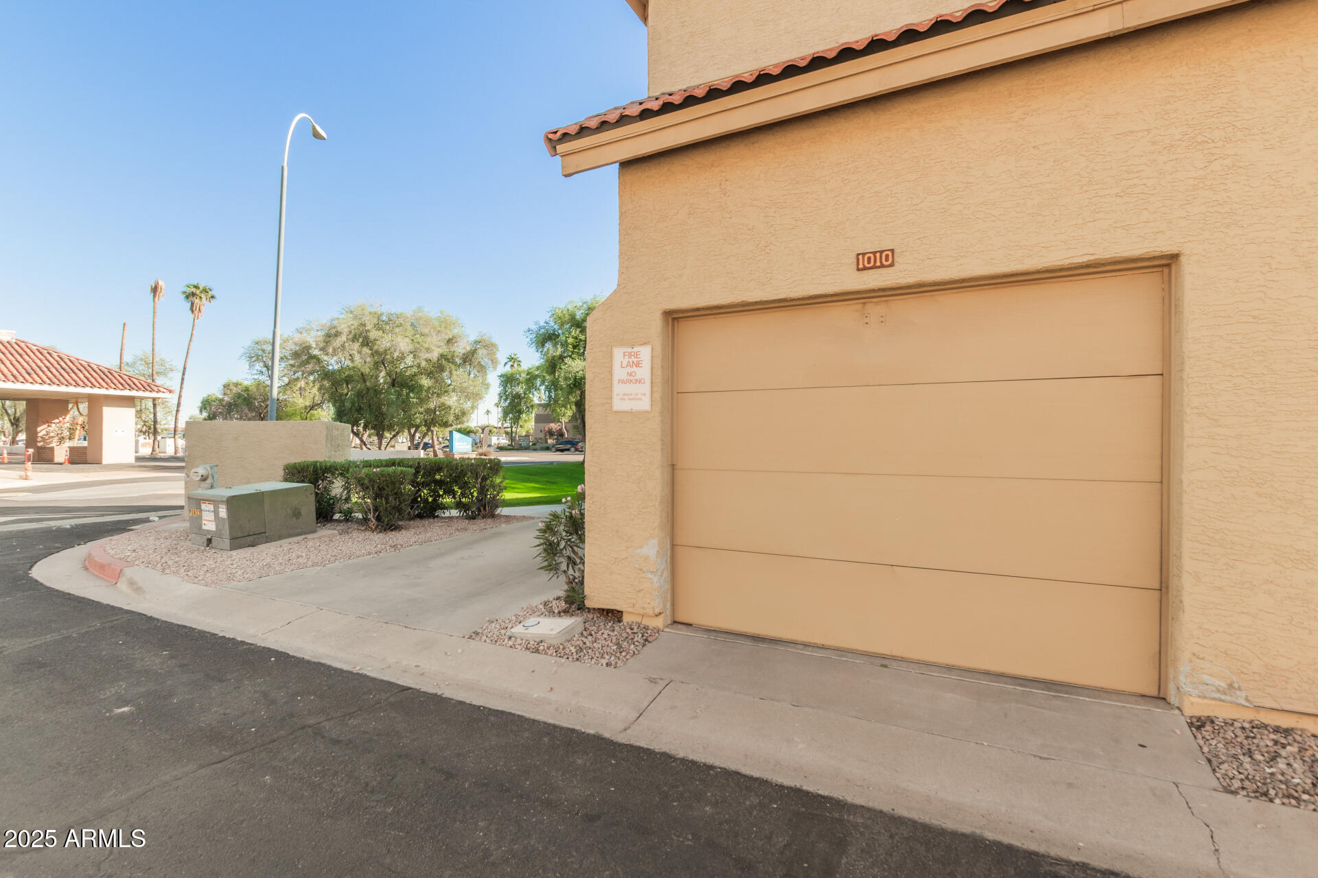 1126 West Elliot Road, Unit 1010 Chandler, AZ 85224 - Photo 24 of 32 a view of a house with a street