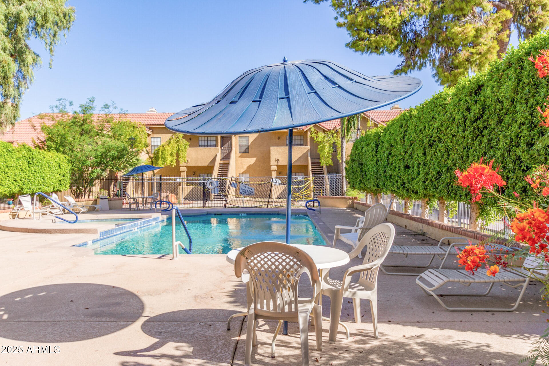 1126 West Elliot Road, Unit 1010 Chandler, AZ 85224 - Photo 26 of 32 a patio with table and chairs