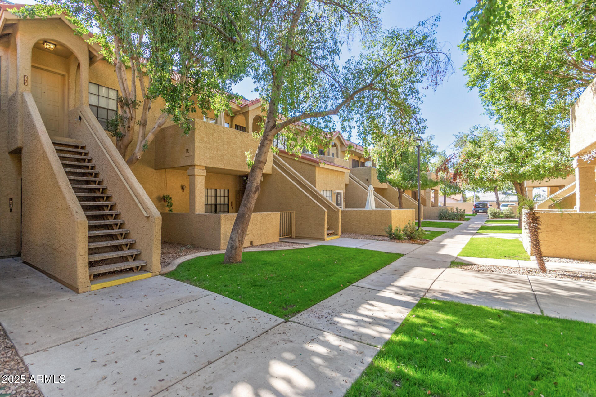 1126 West Elliot Road, Unit 1010 Chandler, AZ 85224 - Photo 28 of 32 a view of a house with a yard