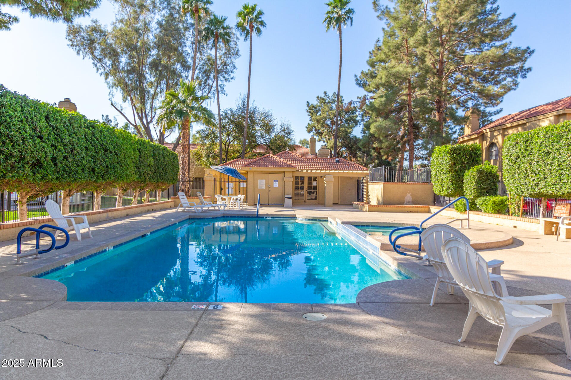 1126 West Elliot Road, Unit 1010 Chandler, AZ 85224 - Photo 31 of 32 a front view of a house with swimming pool having outdoor seating