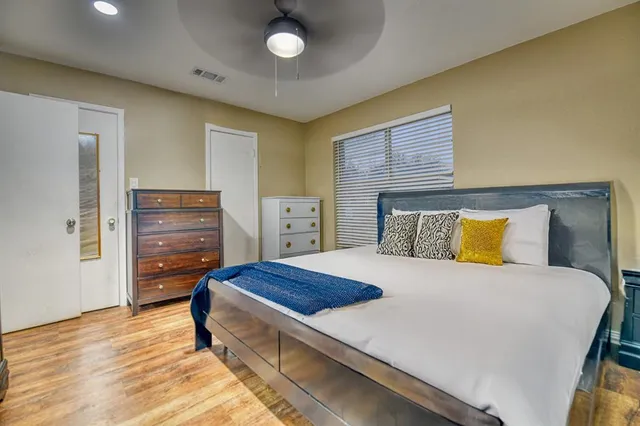 a bedroom with a bed and furniture