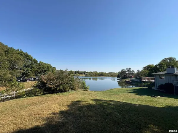 a view of lake with green space