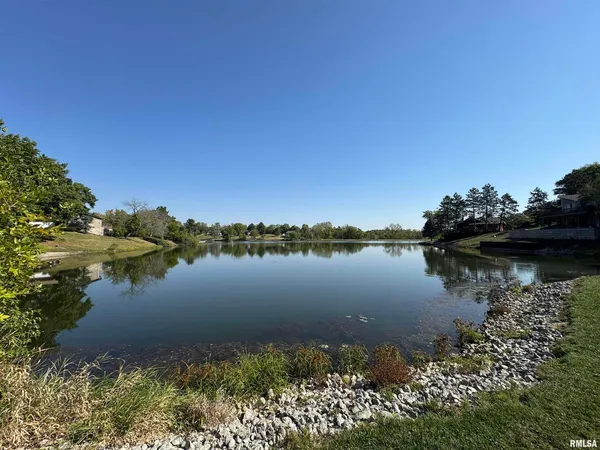 a view of lake with green space