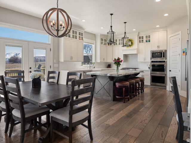 641 West 500 South Midway, UT 84049 - Photo 12 of 52 Open-concept kitchen and dining area featuring wide plank wood-finish flooring