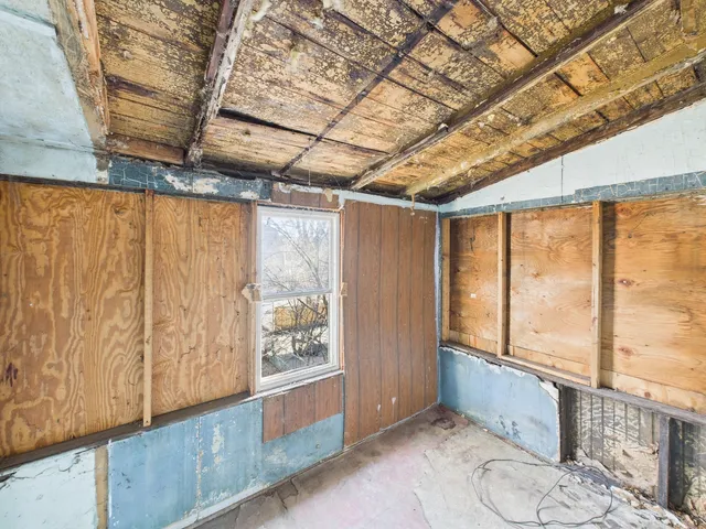 a view of an empty room with glass door