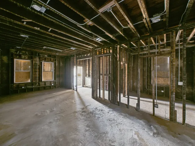 a view of a room with wooden walls