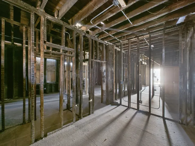 a view of an empty room with glass door