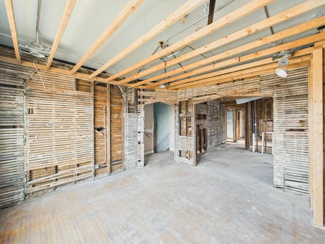 a view of a room with wooden walls
