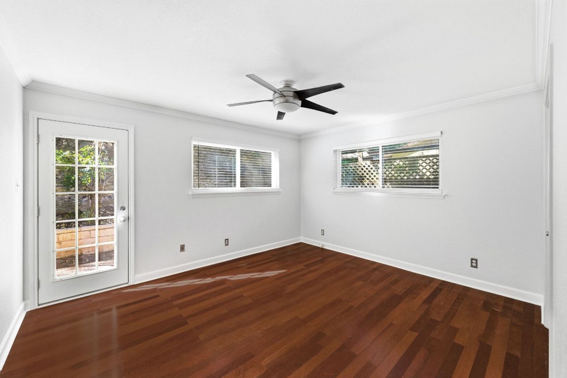6210 Shadow Valley Drive, Unit B Austin, TX 78731 - Photo 17 of 28 Primary bedroom at the back of the unit with door leading to back yard