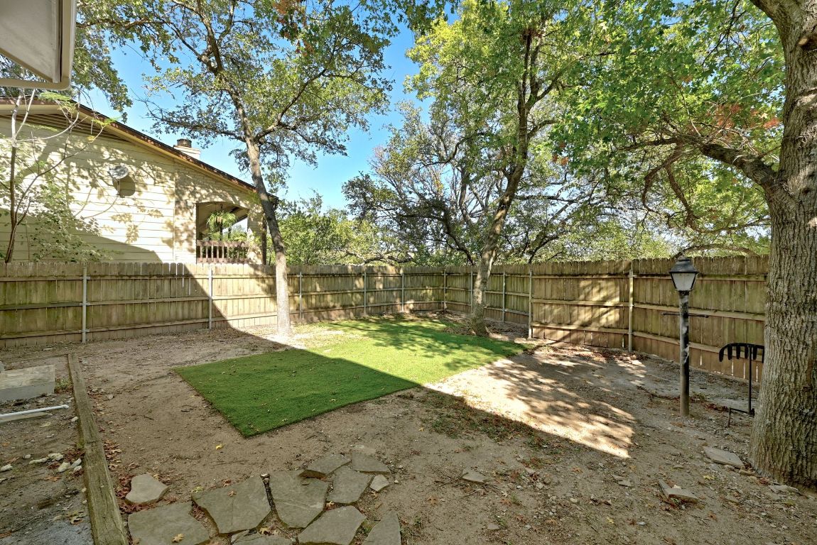 6210 Shadow Valley Drive, Unit B Austin, TX 78731 - Photo 28 of 28 Fenced front yard with a patio