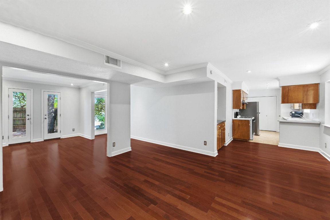 6210 Shadow Valley Drive, Unit B Austin, TX 78731 - Photo 7 of 28 Living room featuring open to office area and kitchen