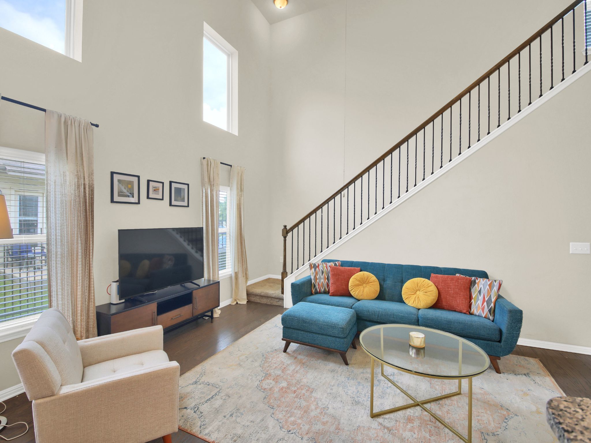 1600 Airedale Road, Unit 2601 Austin, TX 78748 - Photo 17 of 26 A striking open-concept living area with soaring ceilings and rich hardwood flooring.