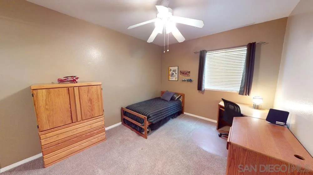 276 South Ralph Road Lake Elsinore, CA 92530 - Photo 11 of 15 a living room with furniture and a window