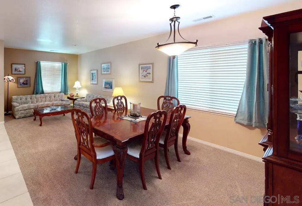 276 South Ralph Road Lake Elsinore, CA 92530 - Photo 3 of 15 a view of a dining room with furniture and window