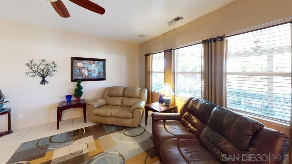 276 South Ralph Road Lake Elsinore, CA 92530 - Photo 6 of 15 a living room with furniture and a large window