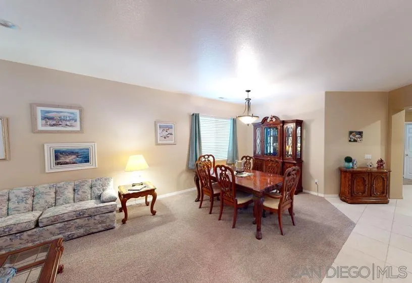 276 South Ralph Road Lake Elsinore, CA 92530 - Photo 9 of 15 a dining room with furniture and chandelier