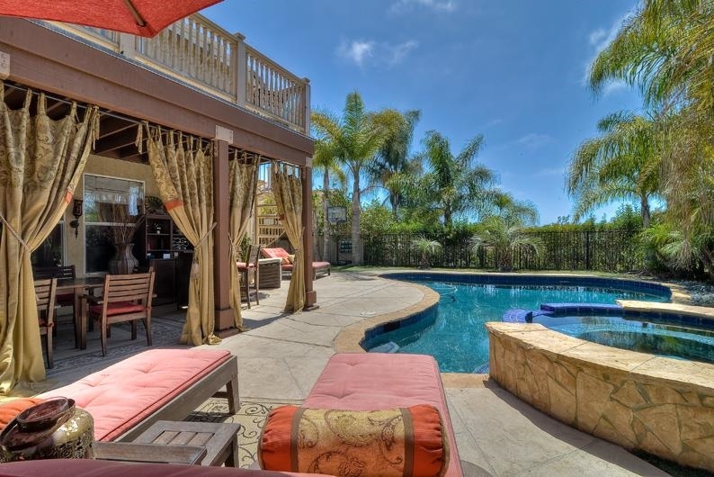 COVERED PATIO DECK OFF KITCHEN AND SPIRAL STAIRCASE FROM MASTER BEDROOM BALACONY