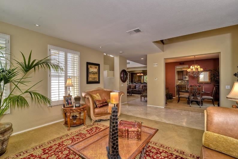 1206 Plum Tree Road Carlsbad, CA 92011 - Photo 11 of 25 FAMILY ROOM LIGHT AND BRIGHT WITH HIGH CEILINGS AND LOTS OF WINDOWS. FIREPLACE AND BUILT-IN MEDIA CENTER.