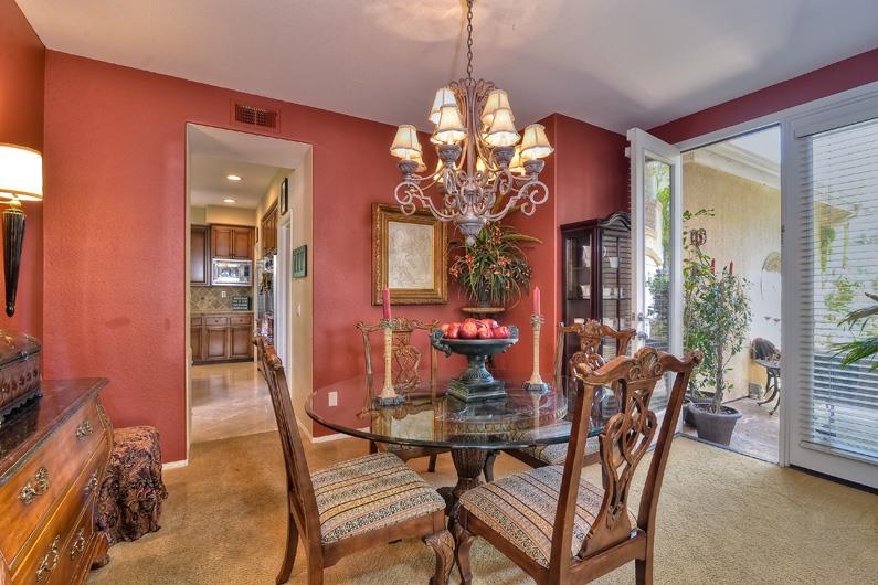 1206 Plum Tree Road Carlsbad, CA 92011 - Photo 10 of 25 QUAINT FORMAL DINING ROOM WITH DOORS TO FRONT COURTYARD AND WATER FEATURE