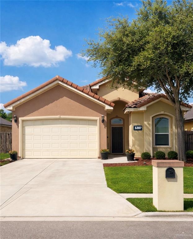 a front view of a house with garage and garage