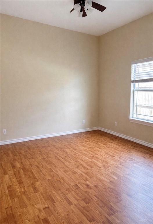 3207 Omega Street Edinburg, TX 78539 - Photo 8 of 13 wooden floor in an empty room
