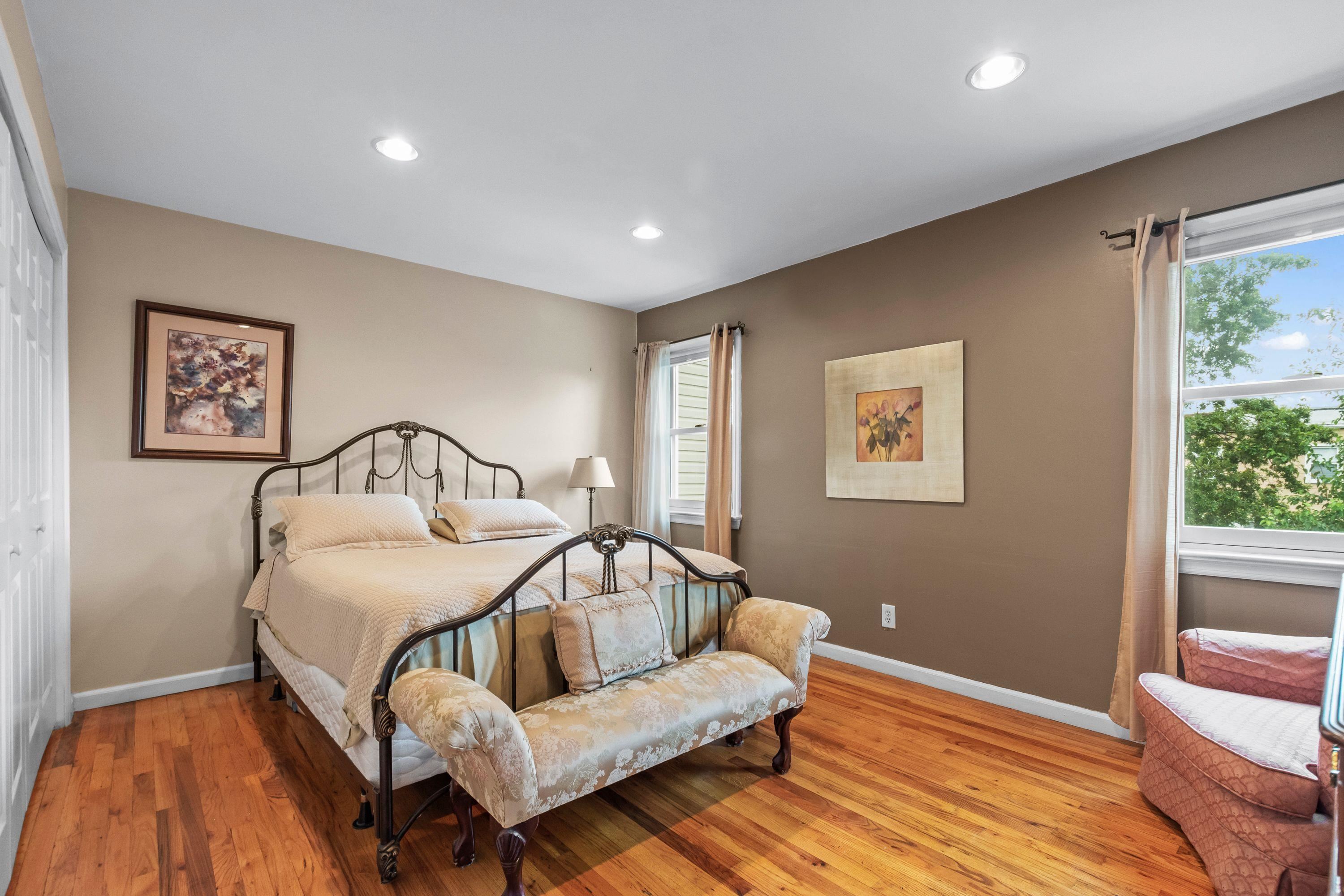 108 Country Village Road Jersey City, NJ 07305 - Photo 8 of 12 a bedroom with a bed and a view of bathroom