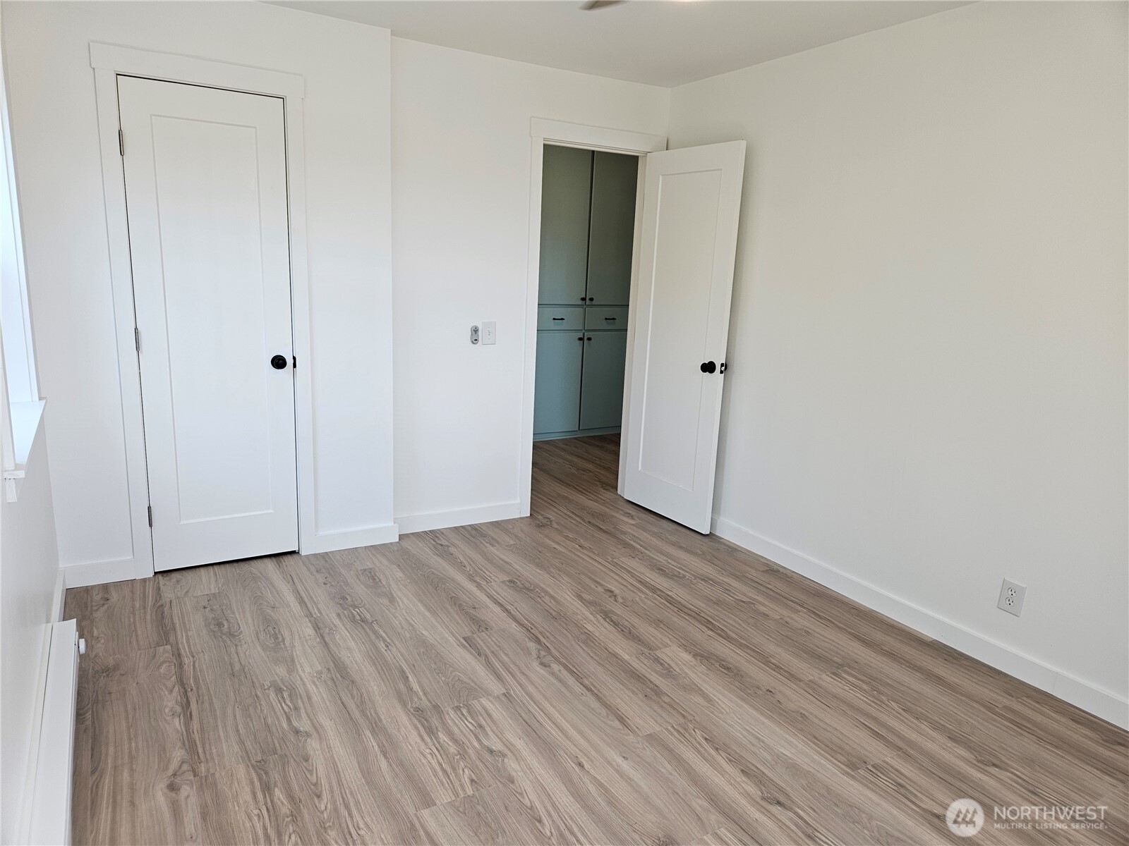 108 West 3rd Street Lind, WA 99341 - Photo 21 of 29 a view of an empty room with wooden floor