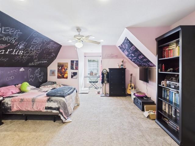 1101 Bunny Rabbit Road Athens, TX 75751 - Photo 32 of 40 a bedroom with a bed furniture and a chandelier