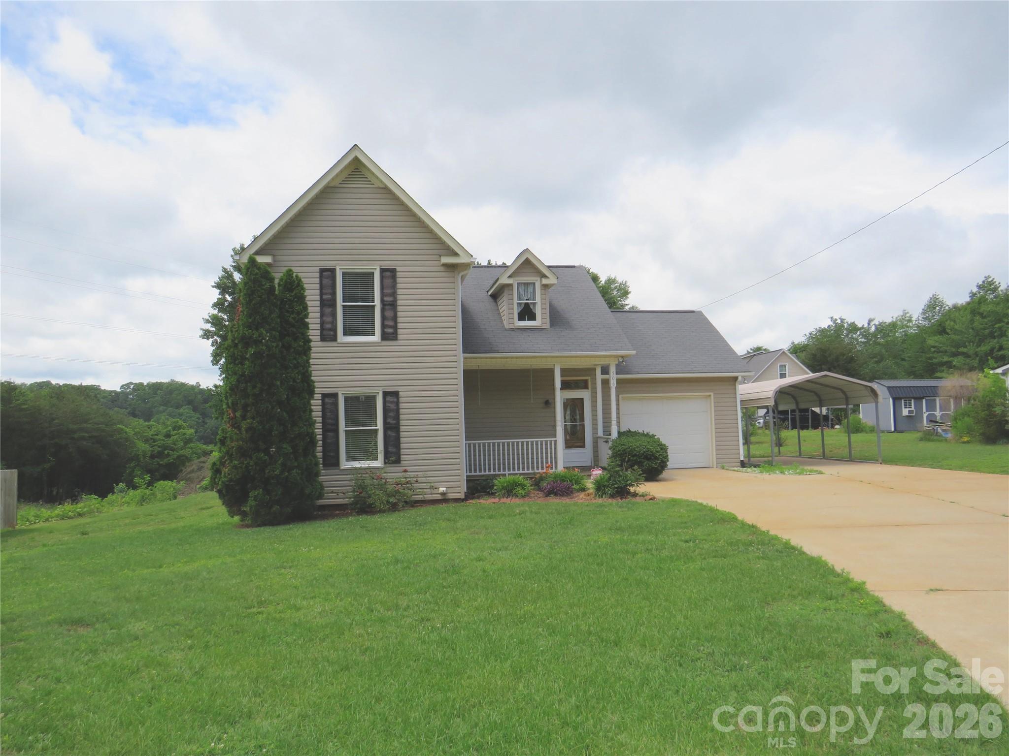 506 Pleasant Street Spindale, NC 28160 - Photo 38 of 42 a front view of a house with garden