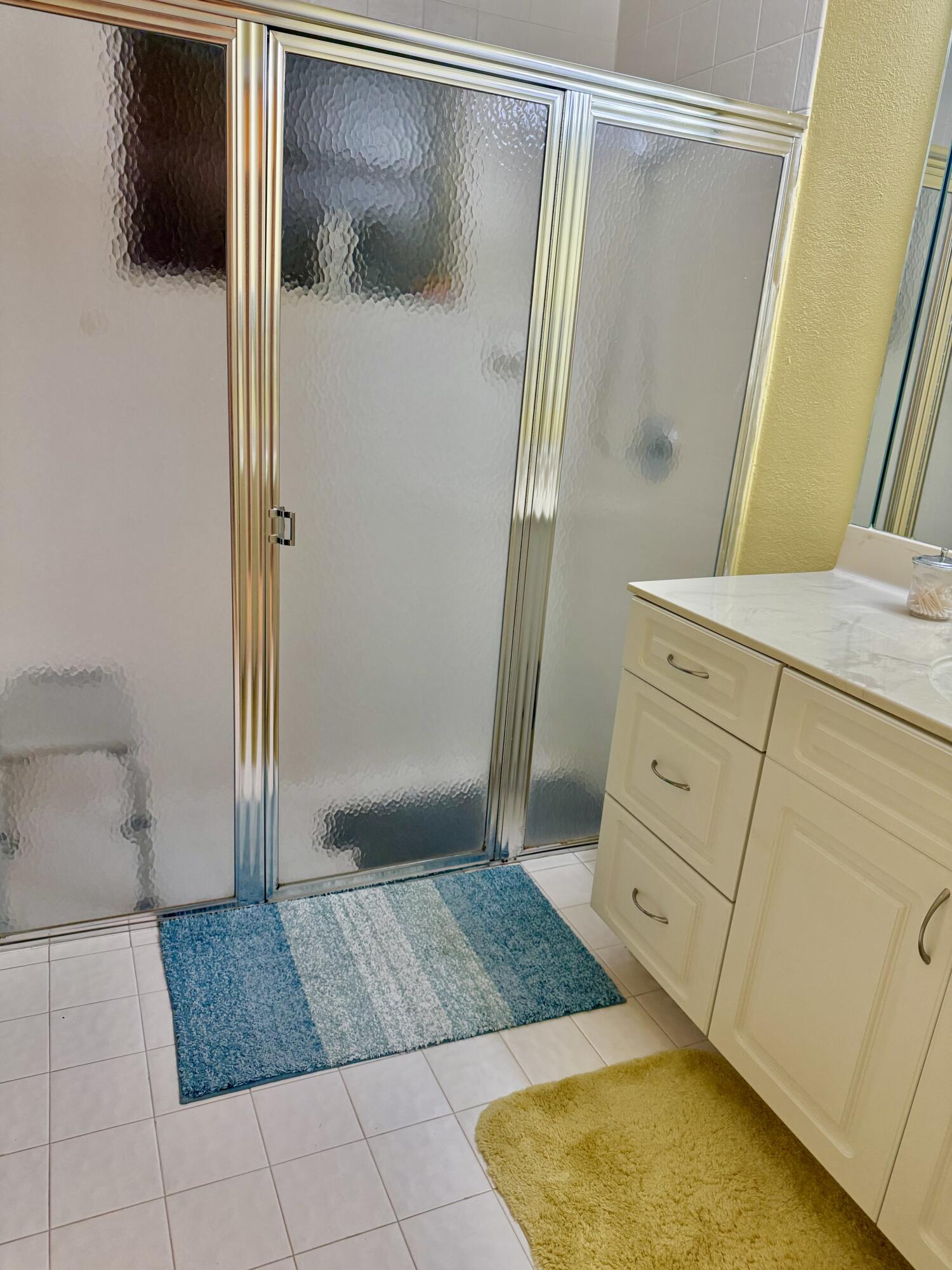 7024 Golf Pointe Circle Tamarac, FL 33321 - Photo 15 of 28 a bathroom with a shower