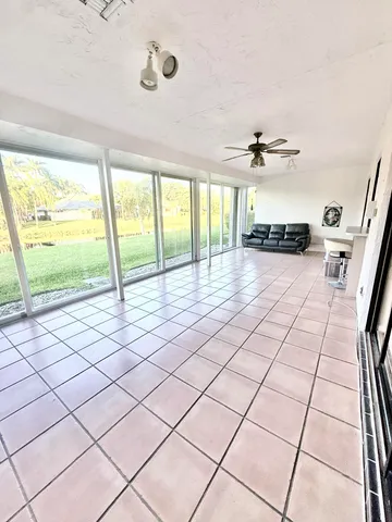 a view of an empty room and a window