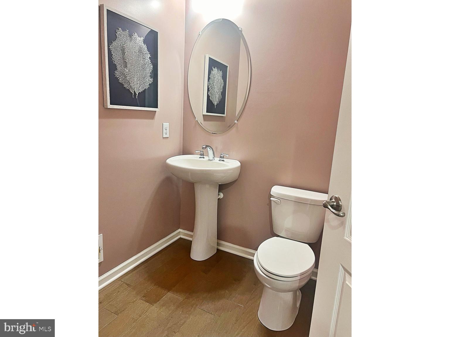 1147 Cardigan Road Middletown, DE 19709 - Photo 15 of 32 a white toilet sitting next to a bathroom sink