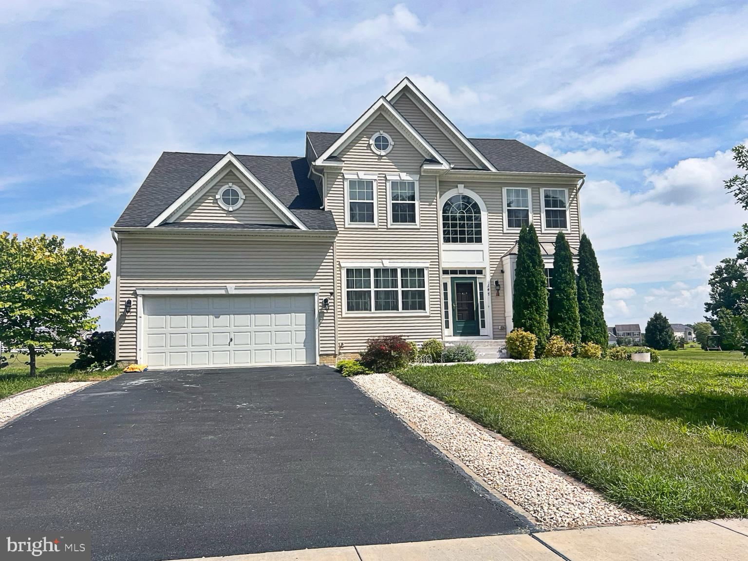 1147 Cardigan Road Middletown, DE 19709 - Photo 2 of 32 a front view of a house with a yard and garage