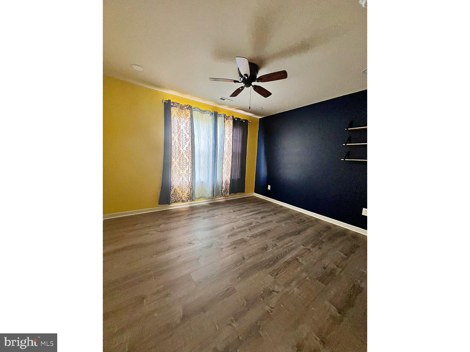 1147 Cardigan Road Middletown, DE 19709 - Photo 21 of 32 a view of a livingroom with a ceiling fan and window