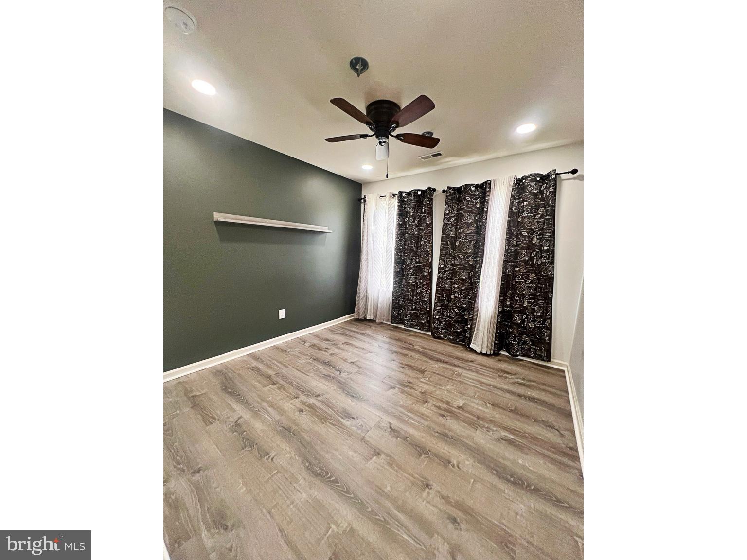 1147 Cardigan Road Middletown, DE 19709 - Photo 22 of 32 a view of a livingroom with a ceiling fan and window