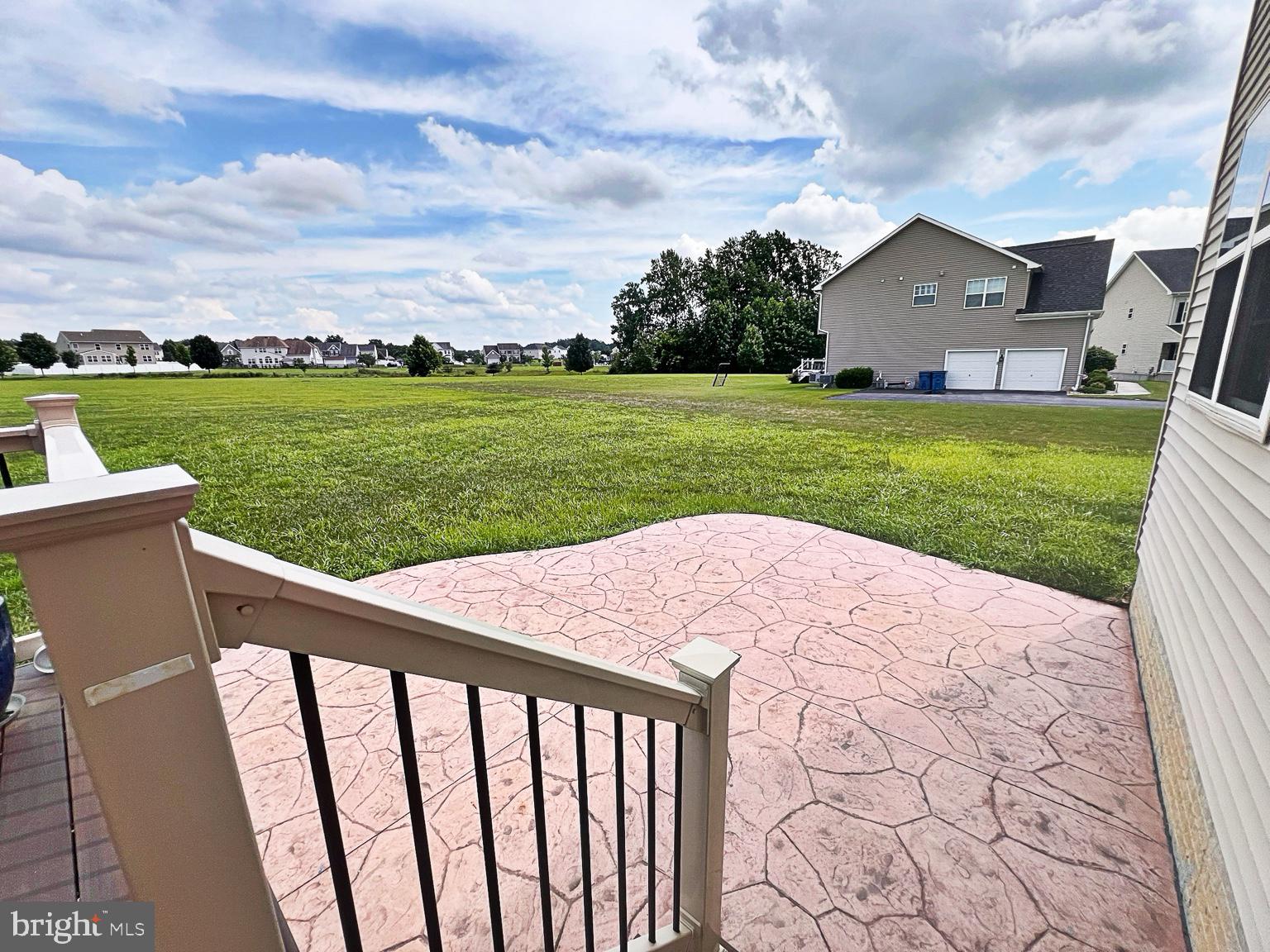 1147 Cardigan Road Middletown, DE 19709 - Photo 31 of 32 a view of a house with a yard and a garden