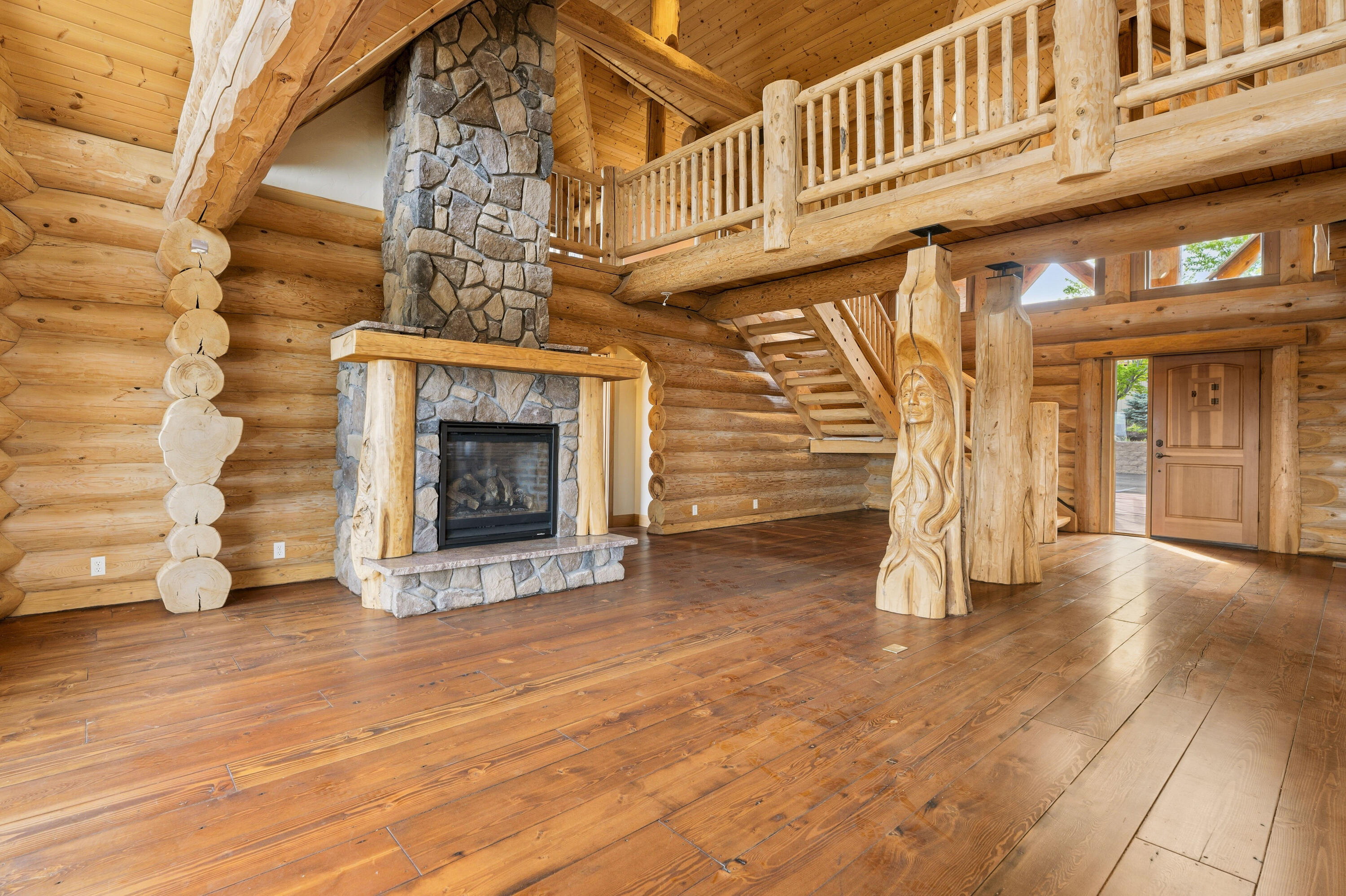 10739 Southwest Shad Road Terrebonne, OR 97760 - Photo 30 of 55 a view of a fireplace with stairs and a wooden floor